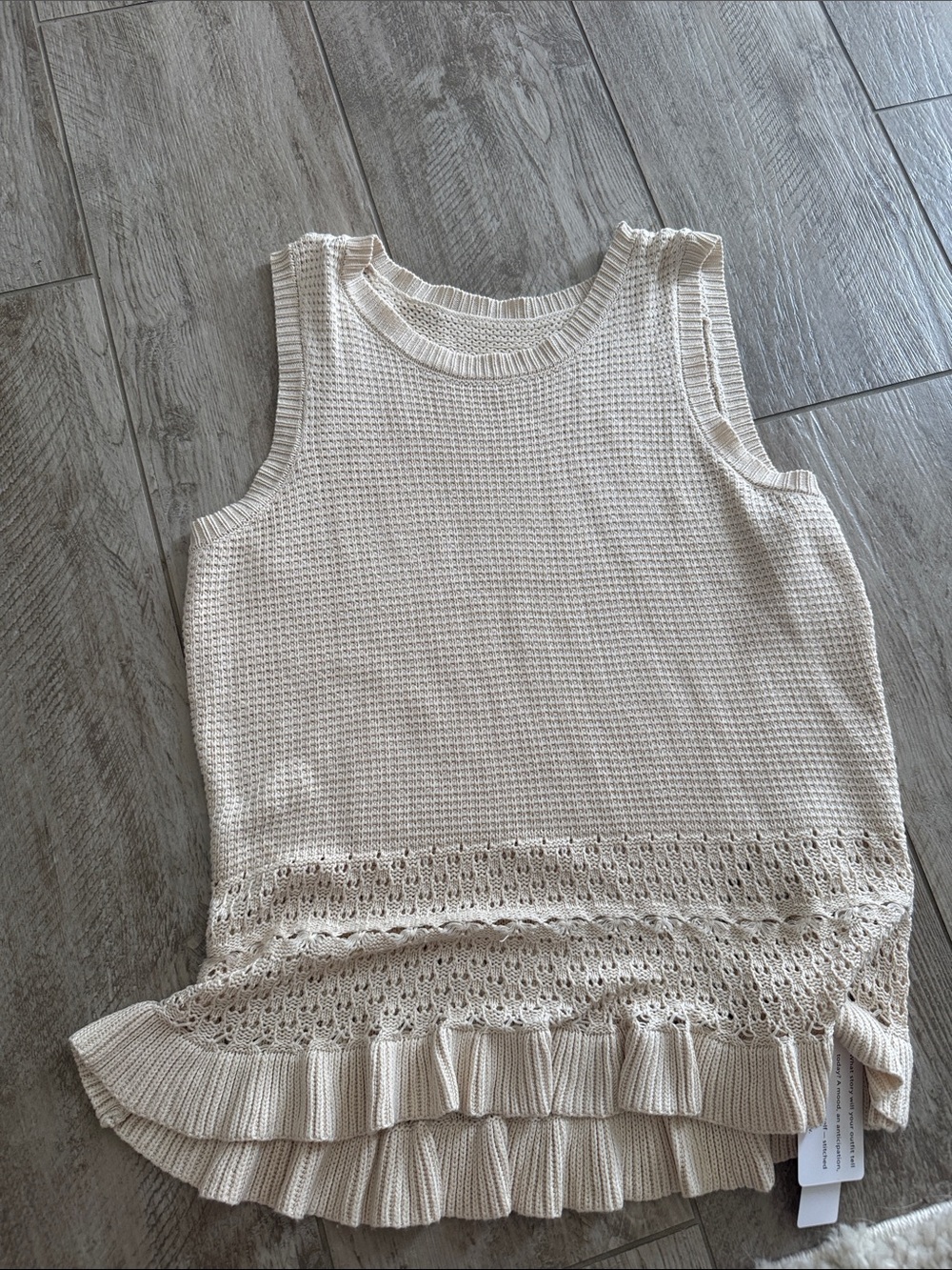 Sleeveless Cream Knit Ruffle-Hem Tank